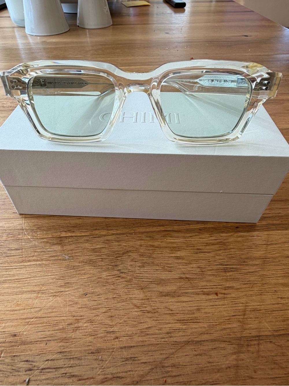 Chimi transition photochromic sunglasses in pale yellow crystal.